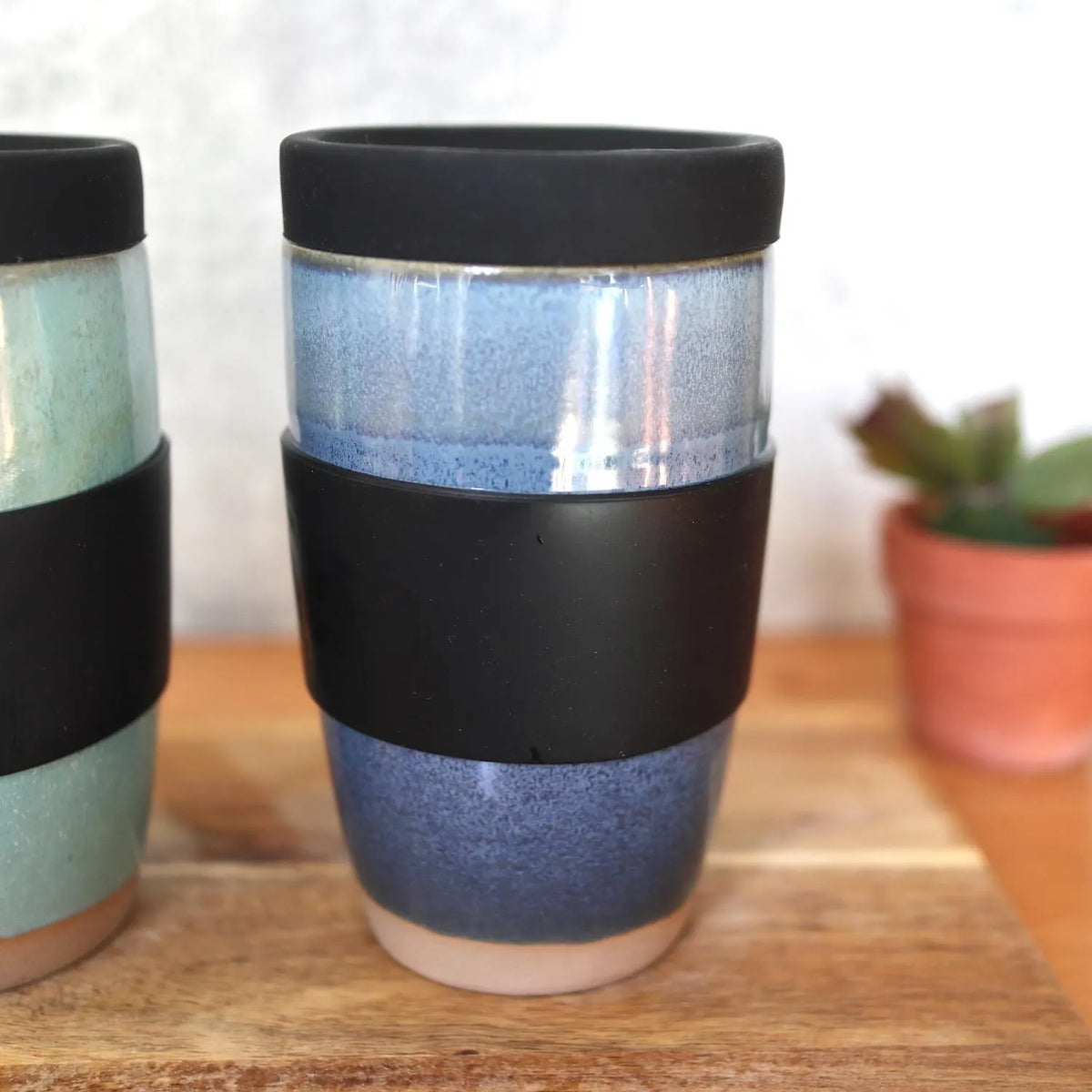 Ceramic travel mug with silicone lid. Handmade travel mug, Handmade ceramic mug, lidded coffee cup, Roam Ceramics.