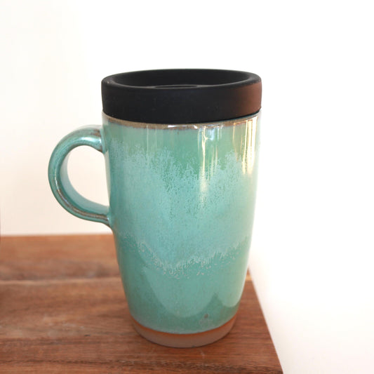 Ceramic travel mug with handle and silicone lid. Handmade travel mug, Handmade ceramic mug, lidded coffee cup, Roam Ceramics.