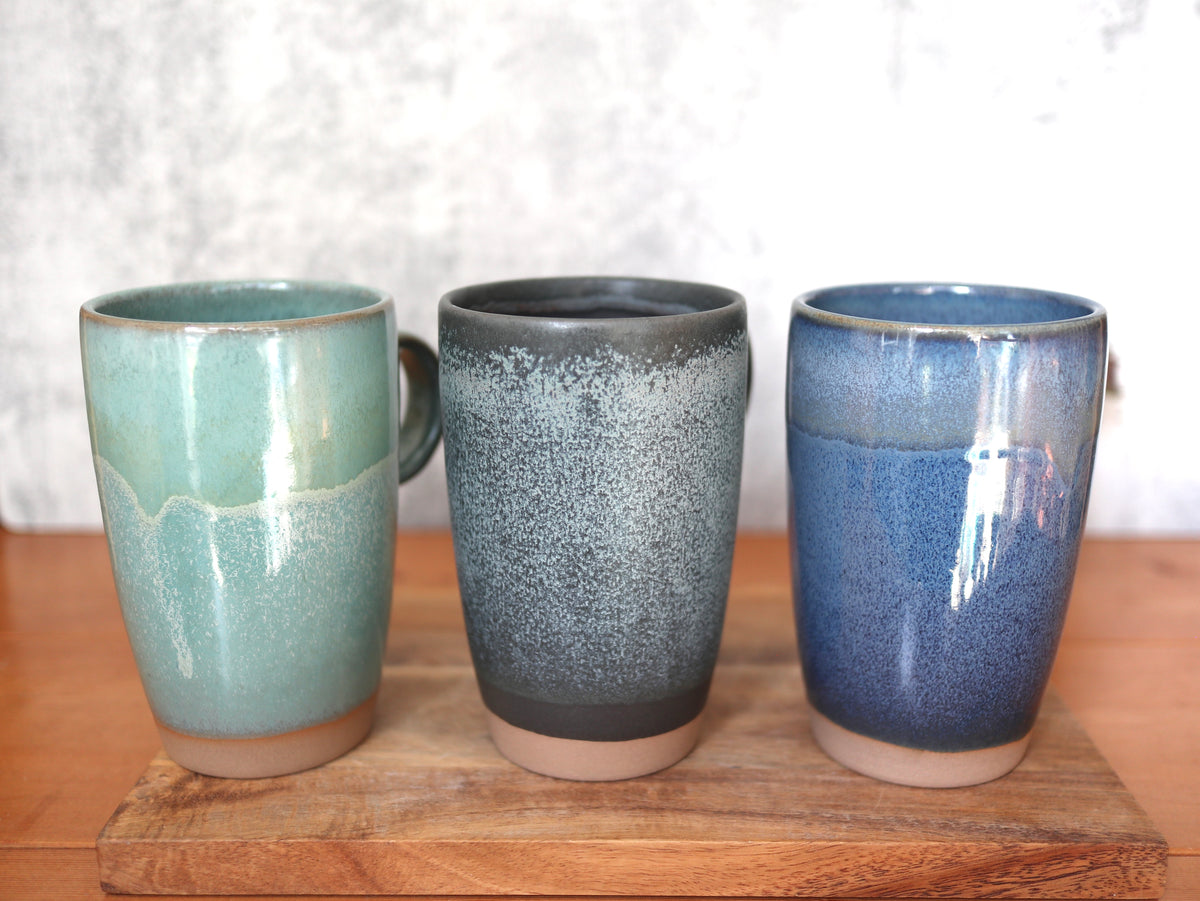 Ceramic travel mug with silicone lid. Handmade travel mug, Handmade ceramic mug, lidded coffee cup, Roam Ceramics.